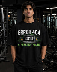 Person wearing a black t-shirt with 'ERROR 404' design in a gym setting